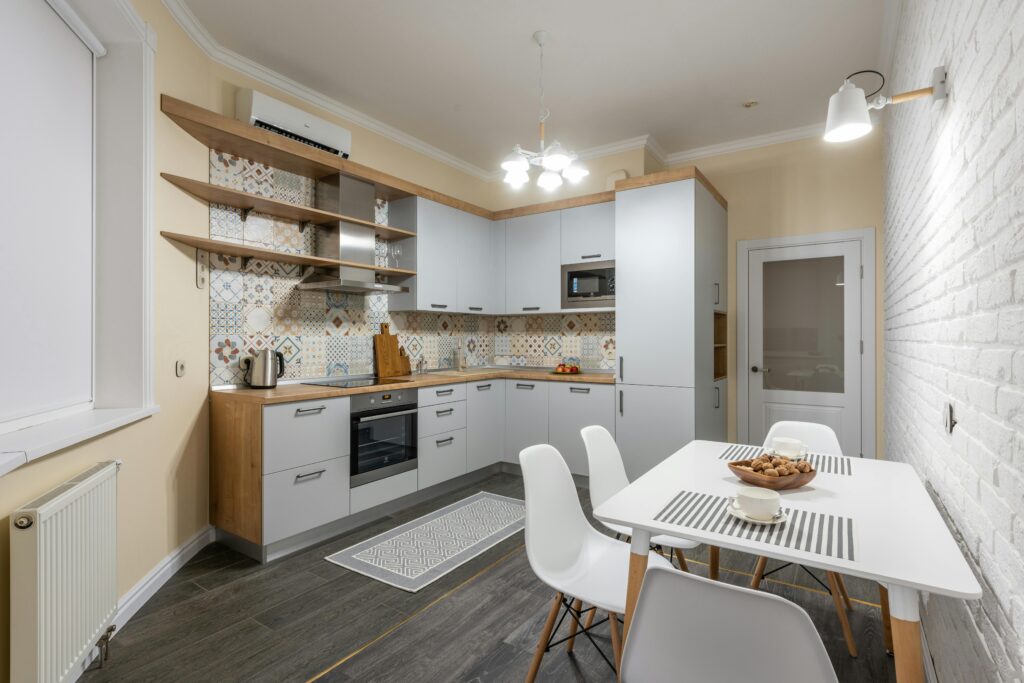 A stylish herringbone pattern tile floor, adding visual interest to the kitchen.