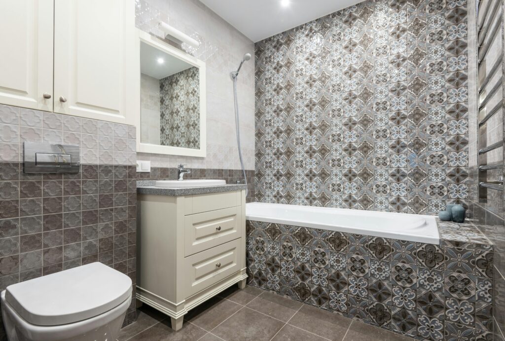 Bathroom shower featuring sleek porcelain tiles.