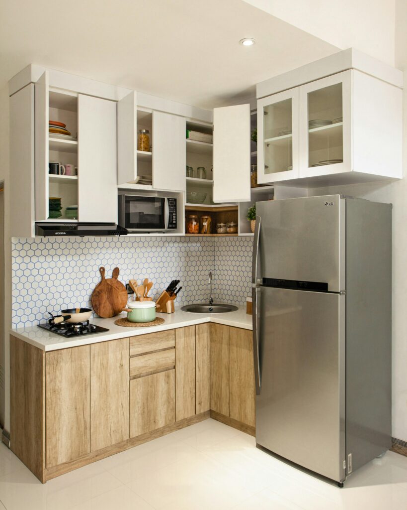 Modern stainless steel refrigerator and stove in a contemporary kitchen.