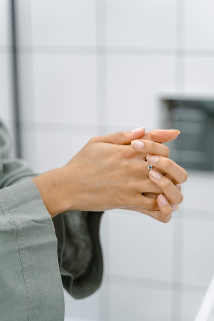 A DIYer installing Peel and Stick Tile in a bathroom with precision.