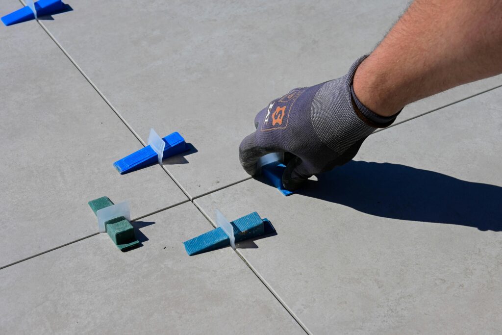 A freshly installed tile floor with grout filling the spaces between the tiles.