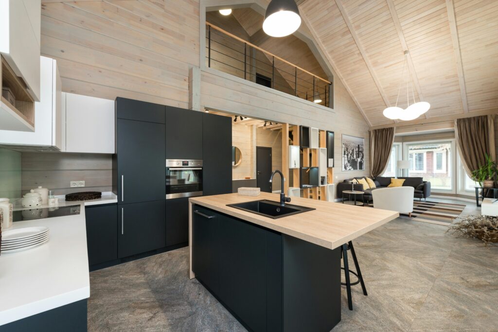 Open-concept Kitchen Sinks And with a modern island and contemporary design.