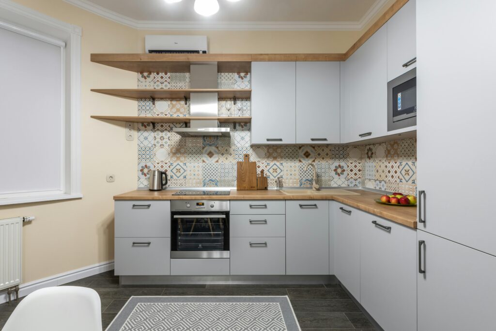pen shelving displaying colorful kitchenware in a modern kitchen design.