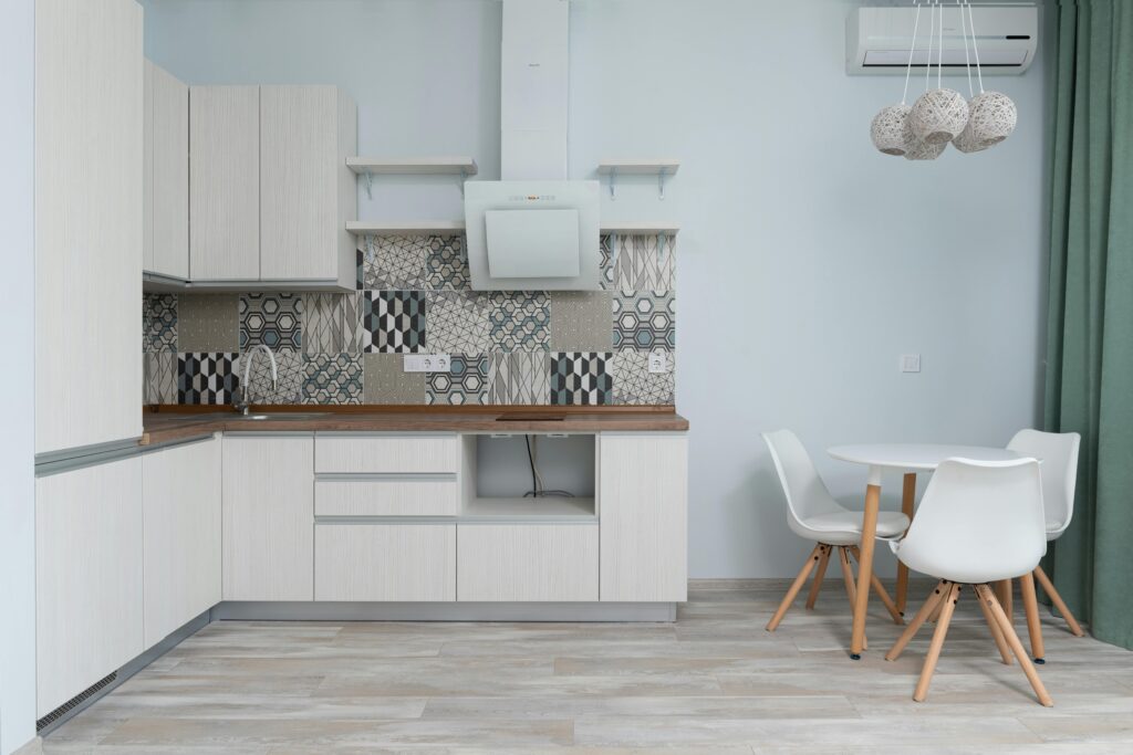 A variety of stickable backsplash designs displayed on a countertop.