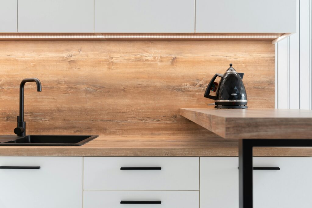 A renter-friendly peel and stick backsplash in a cozy apartment kitchen.