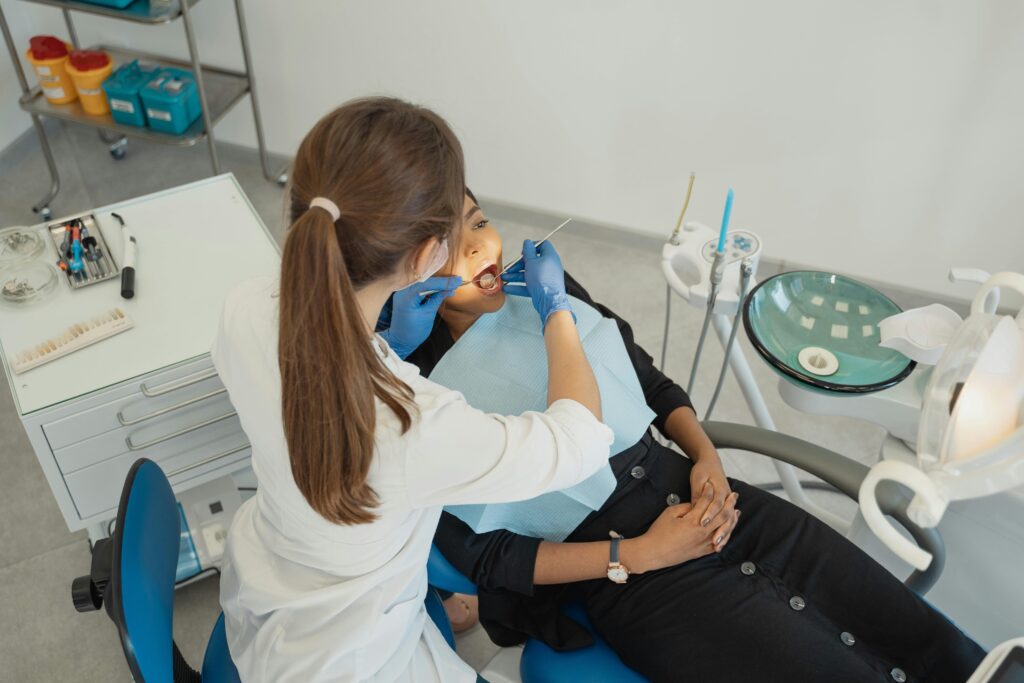 A smiling doctor discussing a health and wellness plan with a patient during a routine check-up